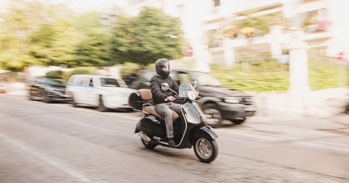 Foreigner riding a motorbike legally in Ho Chi Minh City with a valid driving license