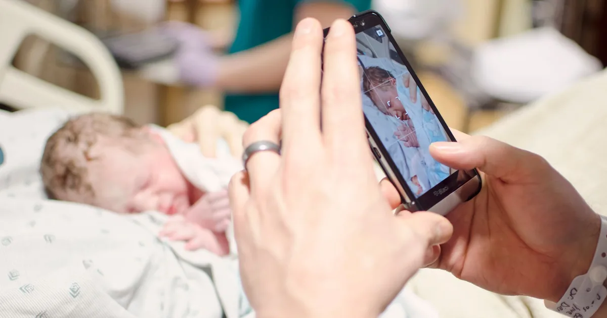 Having a baby in HCMC — new parents with a newborn in a Ho Chi Minh City maternity hospital