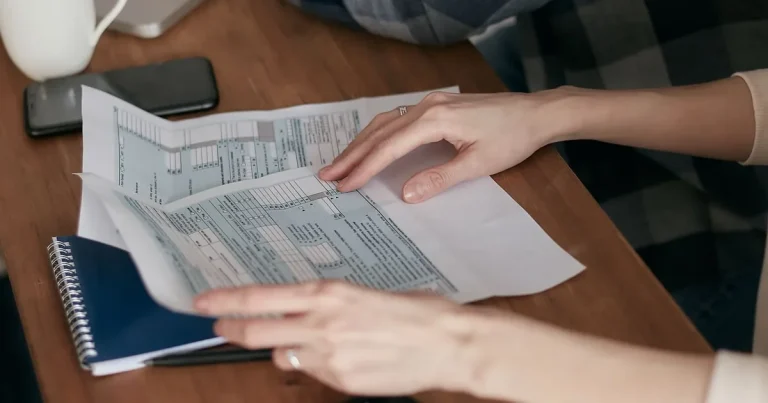 Calculating income tax for expats in Vietnam at a desk in Ho Chi Minh City