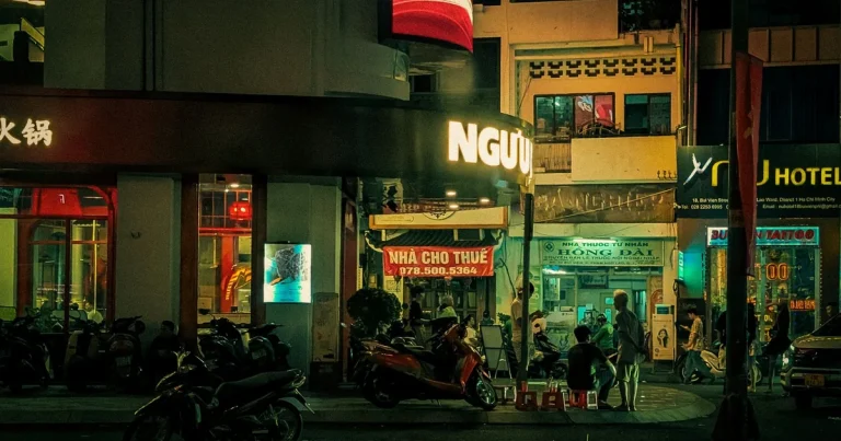 Neon-lit nightlife street in Ho Chi Minh City at night, where nightlife scams in HCMC can occur